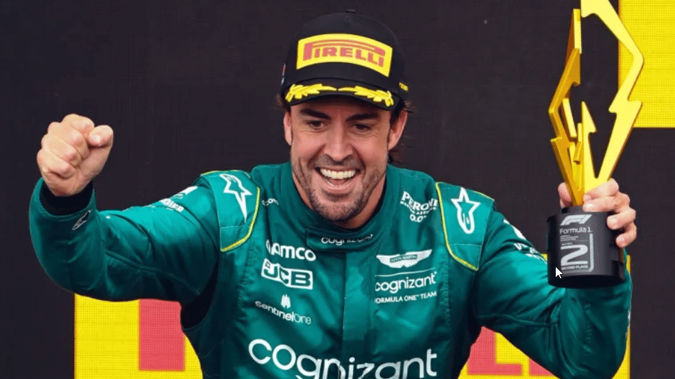 Fernando Alonso holding a trophy