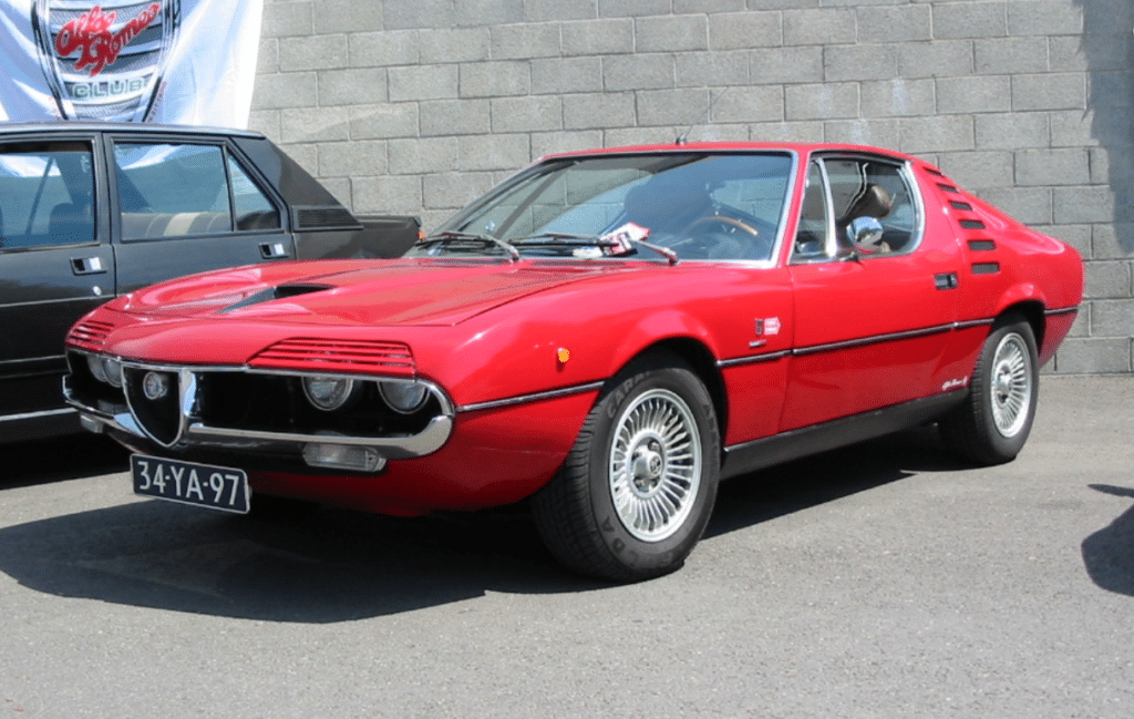 Red Alfa Romeo Montreal coupe in a car park