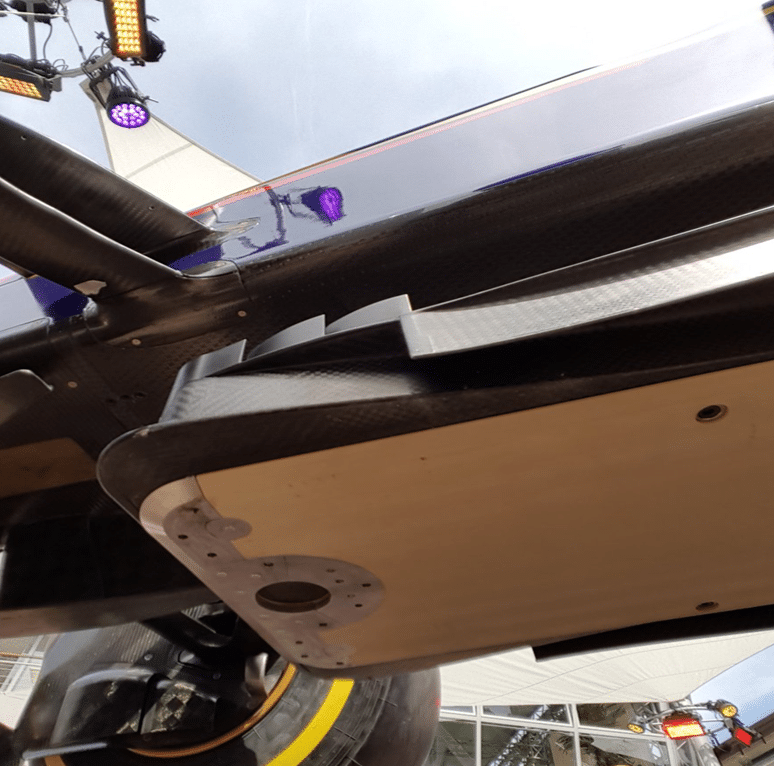 Titanium skid blocks mounted on the F1 car floor plank