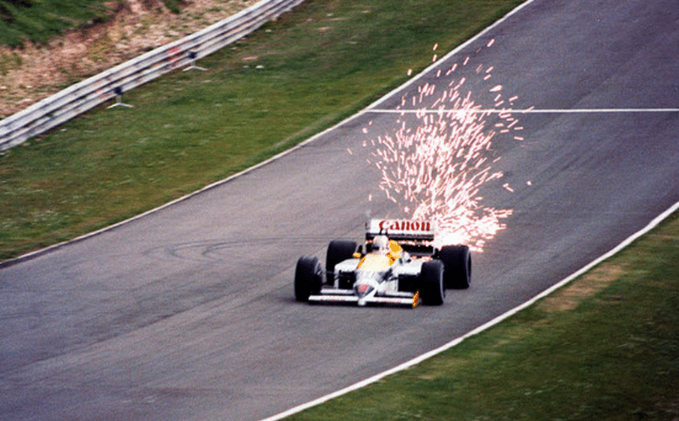 Nigel Mansell Williams F1 car throwing sparks through a corner