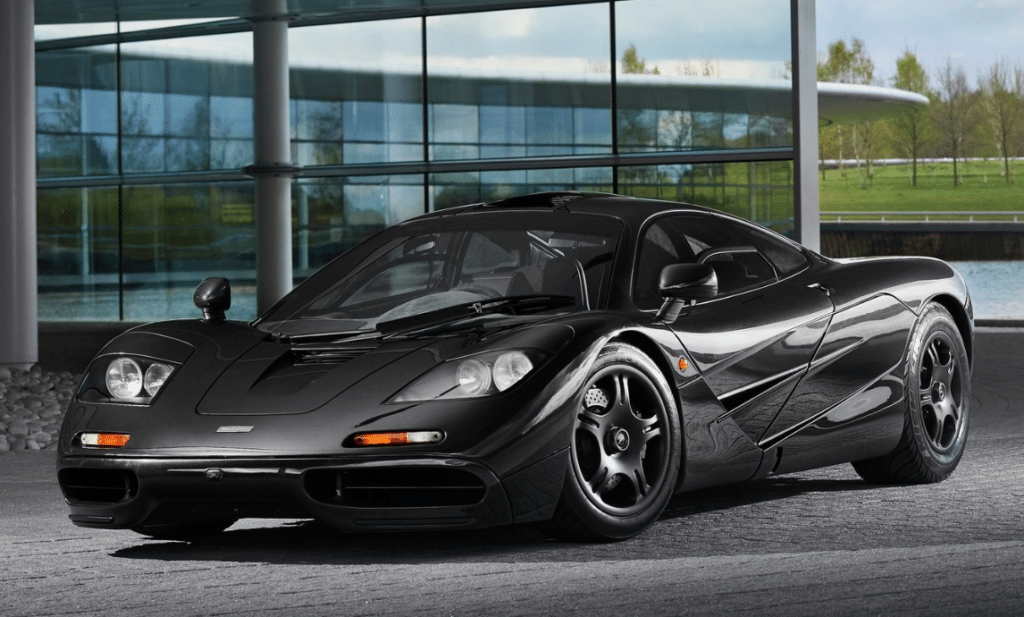 Black McLaren F1 supercar parked outside