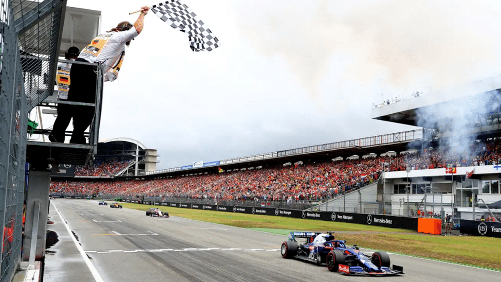 Official waving the chequered flag at a Grand Prix finish