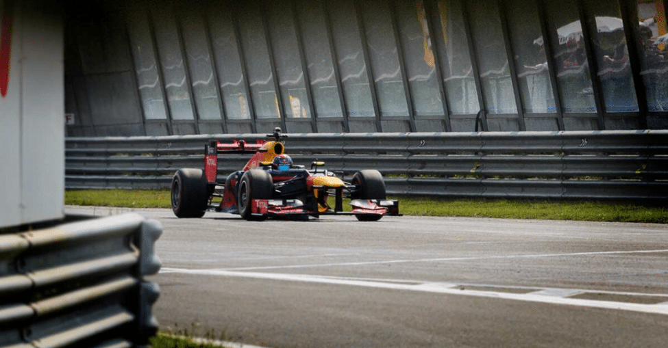 Red Bull F1 car navigating a tight circuit corner at Zandvoort