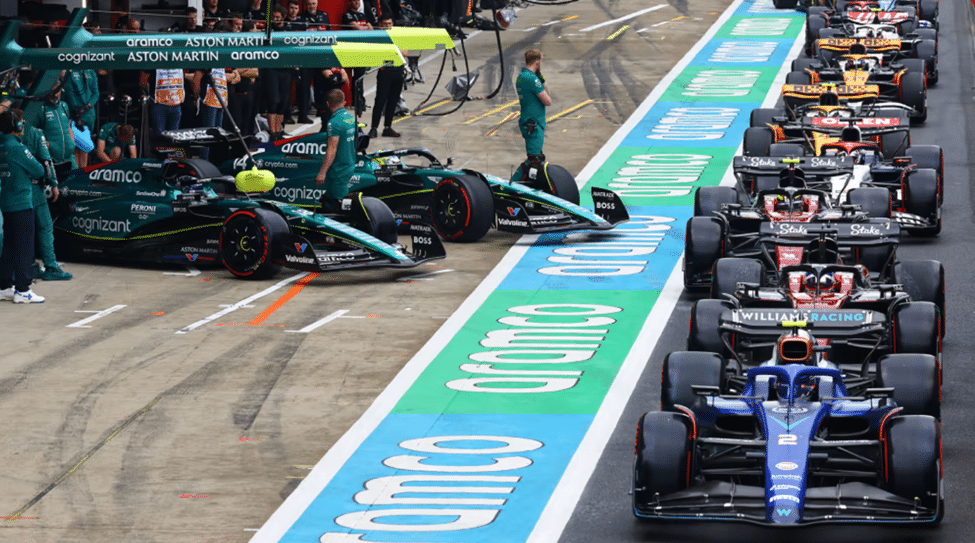 F1 cars lined up in pit lane during a qualifying session