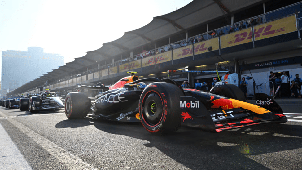 Red Bull F1 car exiting pit lane ahead of rivals during qualifying