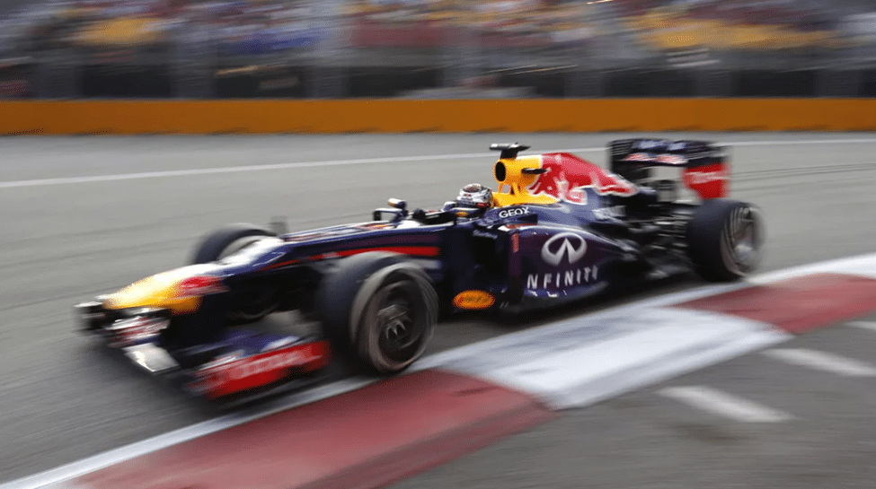 Red Bull F1 car cornering at speed on track