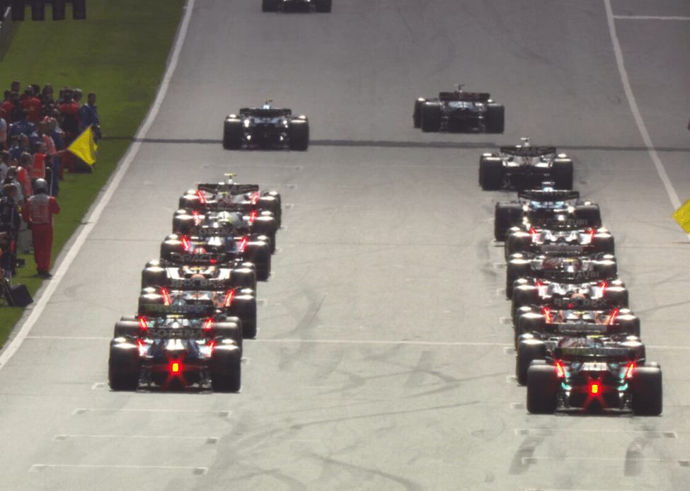F1 cars lined up on the starting grid before race